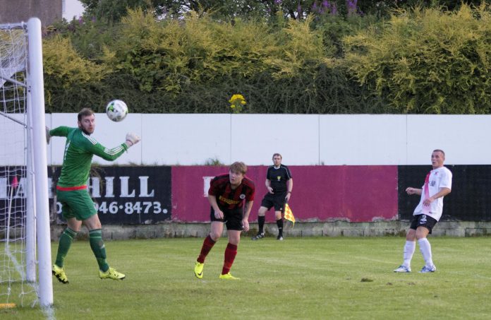 Mark Burbidge directs a well timed volley past Jack Baker to double Bankies lead