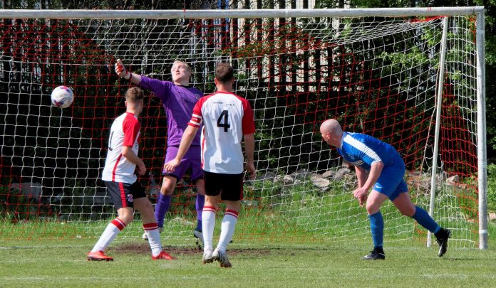 Scott Anson is unmarked at the back post as he doubles the Nock lead