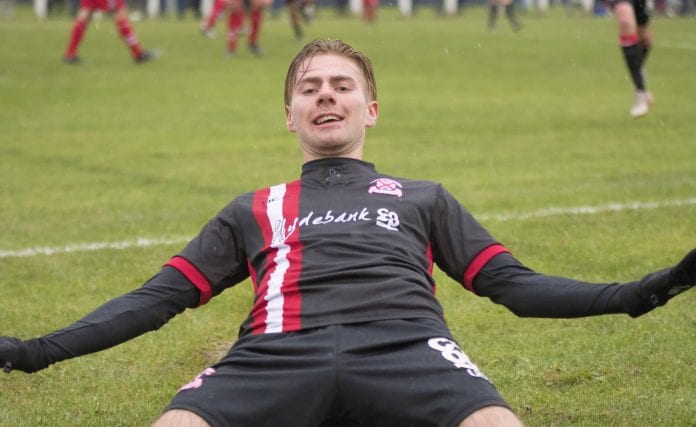 Cammy McClair straight down the lens in celebration